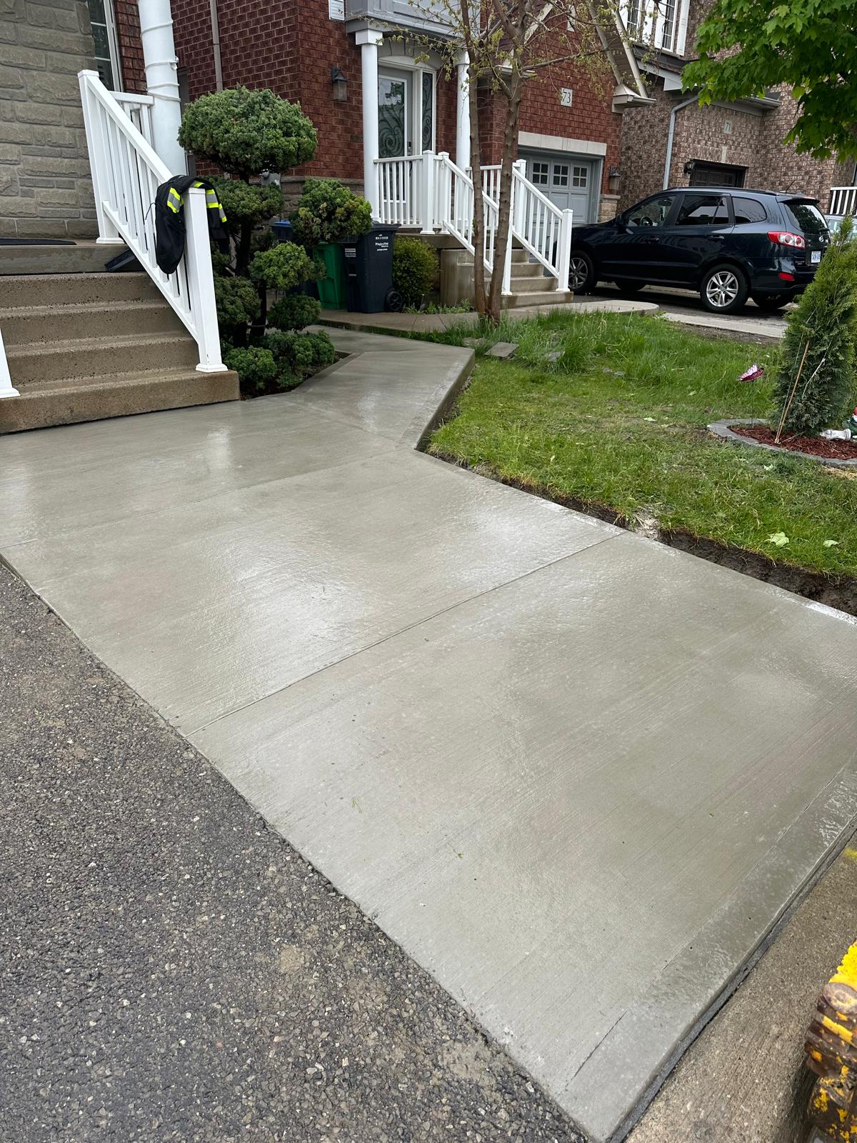 Broomed concrete driveway — High Spirit Build Brampton